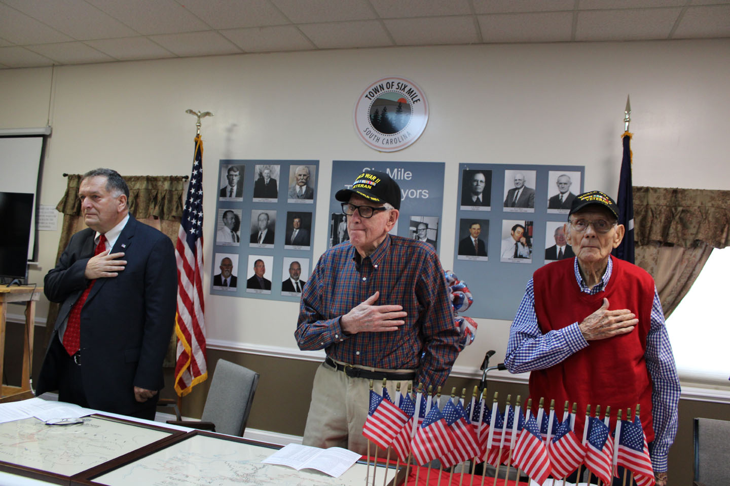 Mayor Atkinson, Raymond Dawkins, and Edward Zeigler during the national anthem. (Photo by Karen Brewer, The Pickens County Chronicle)