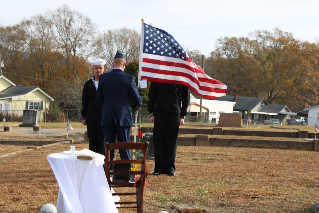 Major Quincy Newman, USMC, lays the first wreath, in honor of the unknown soldiers. (Photo by Karen Brewer, The Pickens County Chronicle)