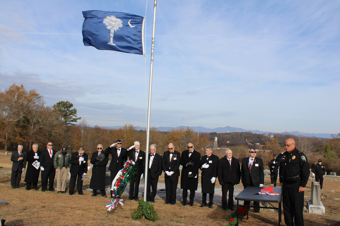 Chief Beach and the Knights of Columbus during the playing of "Taps". (Photo by Karen Brewer, The Pickens County Chronicle)