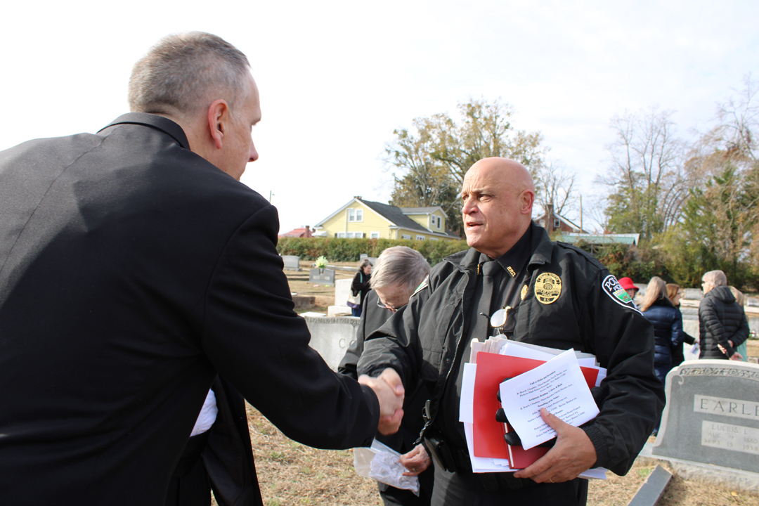 Chief Beach shakes hands with Jeff Holt, a member of the Knights of Columbus, following the Wreaths Across America ceremony at Sunrise Cemetery. (Photo by Karen Brewer, The Pickens County Chronicle)