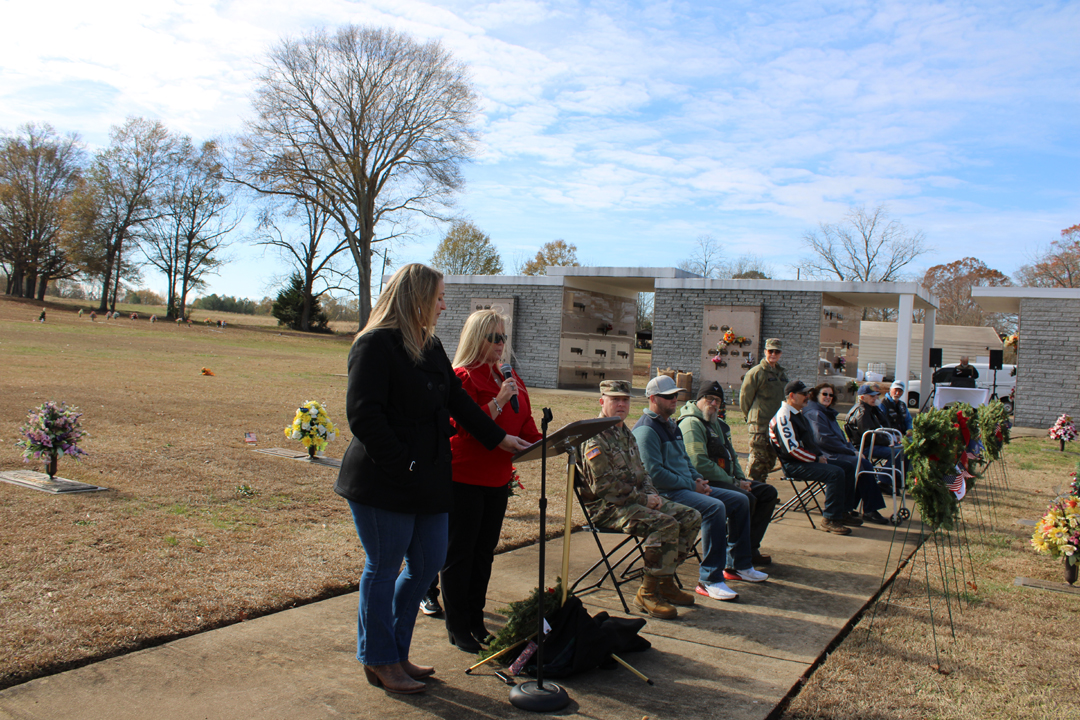 Amy Barrett, organizer of the Wreaths Across America ceremony at Liberty Memorial Gardens, welcomes everyone. (Photo by Karen Brewer, The Pickens County Chronicle)