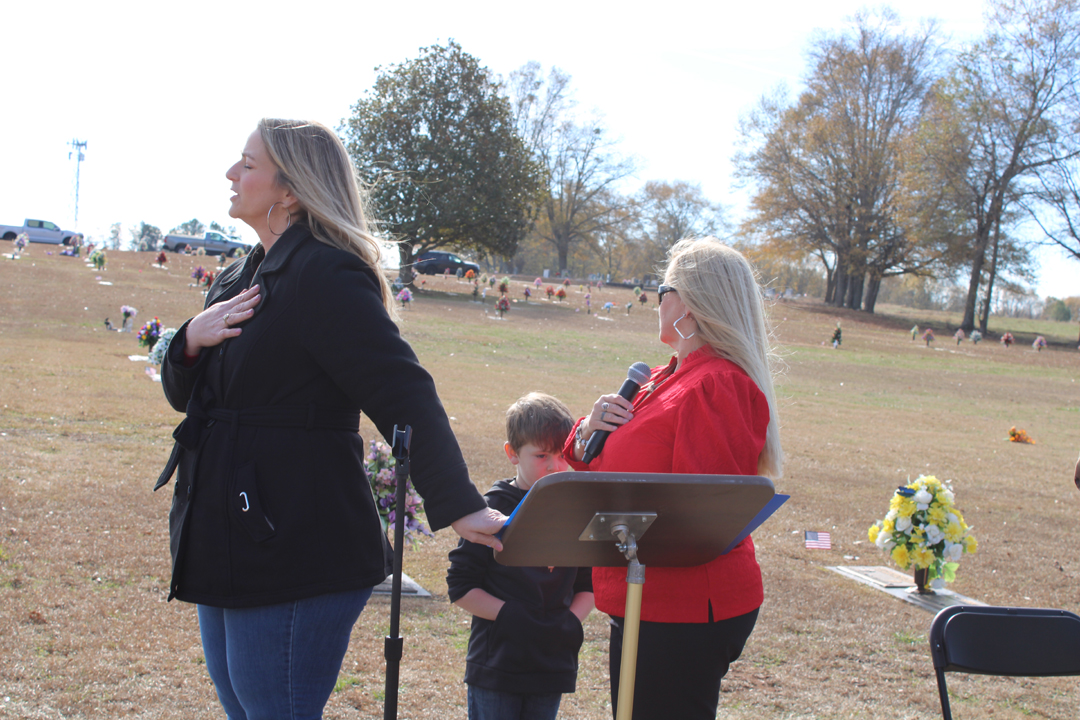 Melanie Gillespie, Amy Barrett, and Easton Barrett during the Pledge of Allegiance to the American flag. (Photo by Karen Brewer, The Pickens County Chronicle)