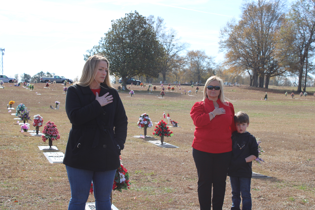 Melanie Gillespie, Amy Barrett, and Easton Barrett during the national anthem (Photo by Karen Brewer, The Pickens County Chronicle)