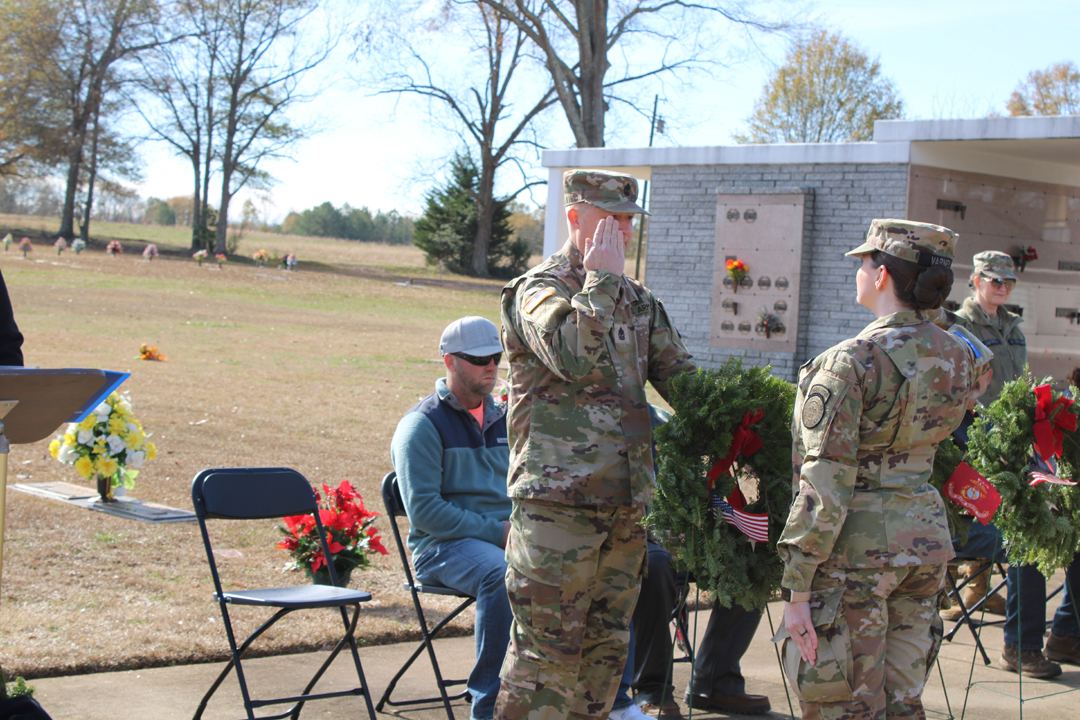 Jadd Smith, US Army, places a wreath in memory of those who served in the US Army (Photo by Karen Brewer, The Pickens County Chronicle)