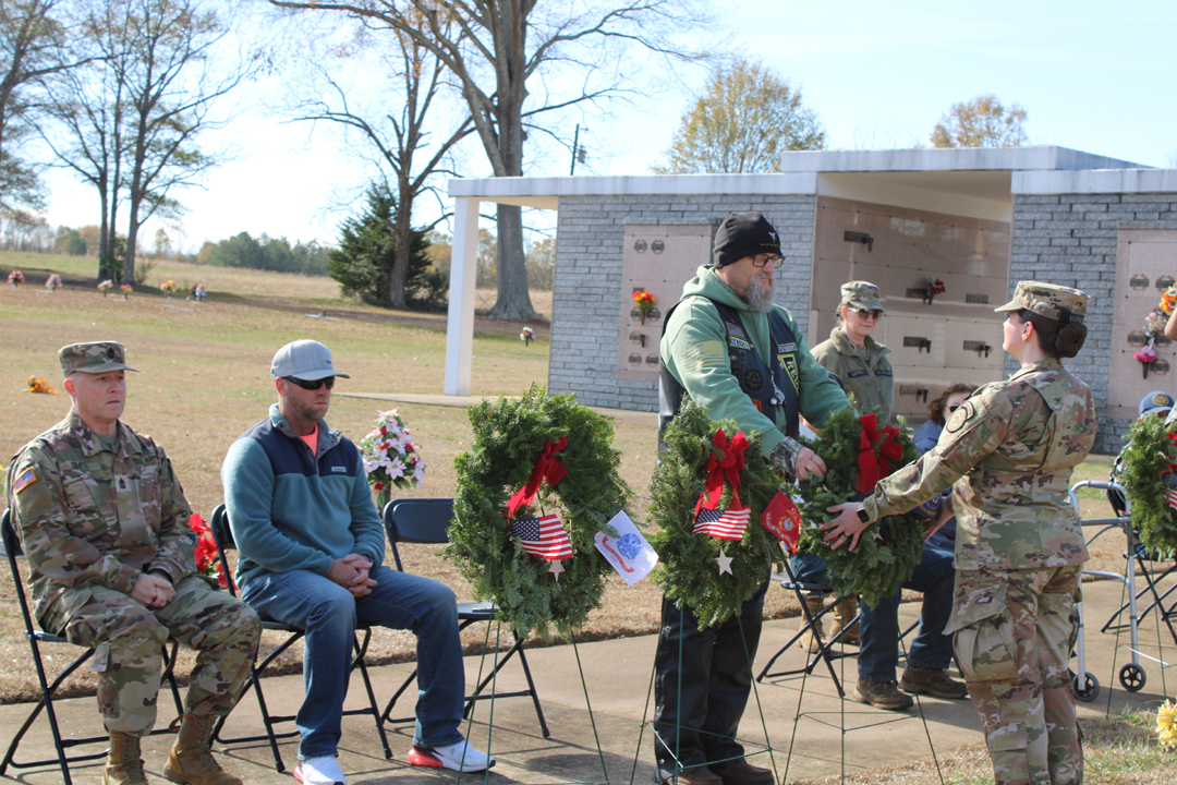 Eric Higham, US Army, places a wreath in memory of those who served in the US Navy (Photo by Karen Brewer, The Pickens County Chronicle)