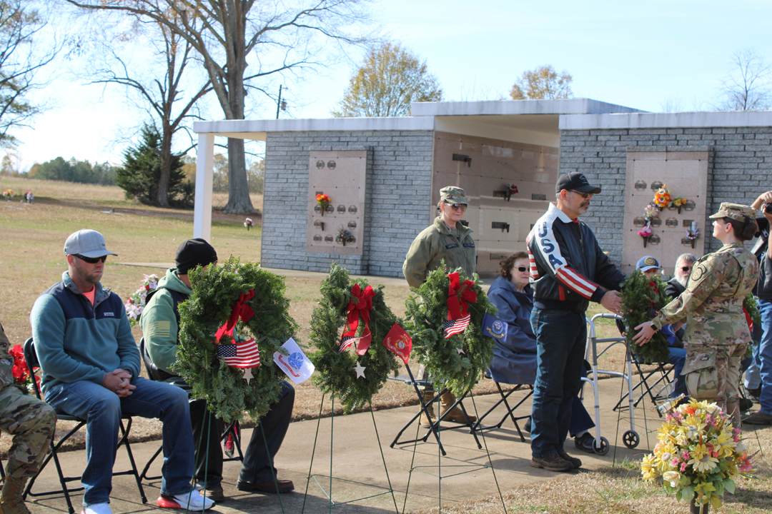 Scott Lang, US Air Force, places a wreath in memory of those who served in the US Air Force (Photo by Karen Brewer, The Pickens County Chronicle)