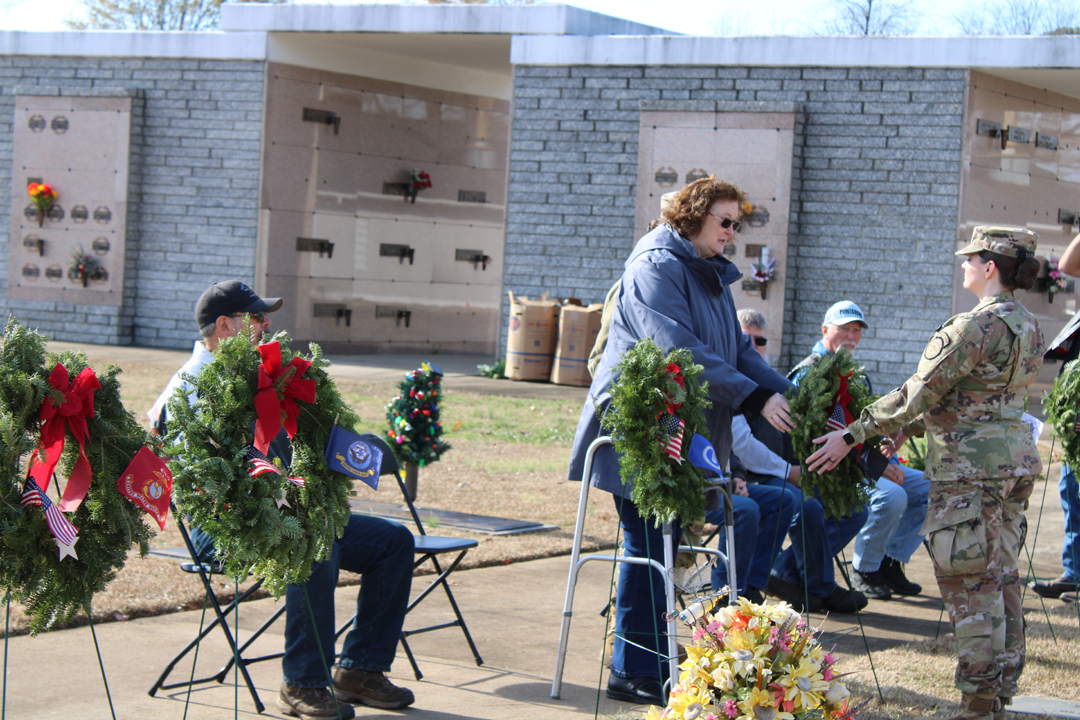 Sherry Harris, US Army, past Commander of American Legion Post 67 and past Pickens County Veterans Affairs Officer, places a wreath for those serving in the US Space Force (Photo by Karen Brewer, The Pickens County Chronicle)