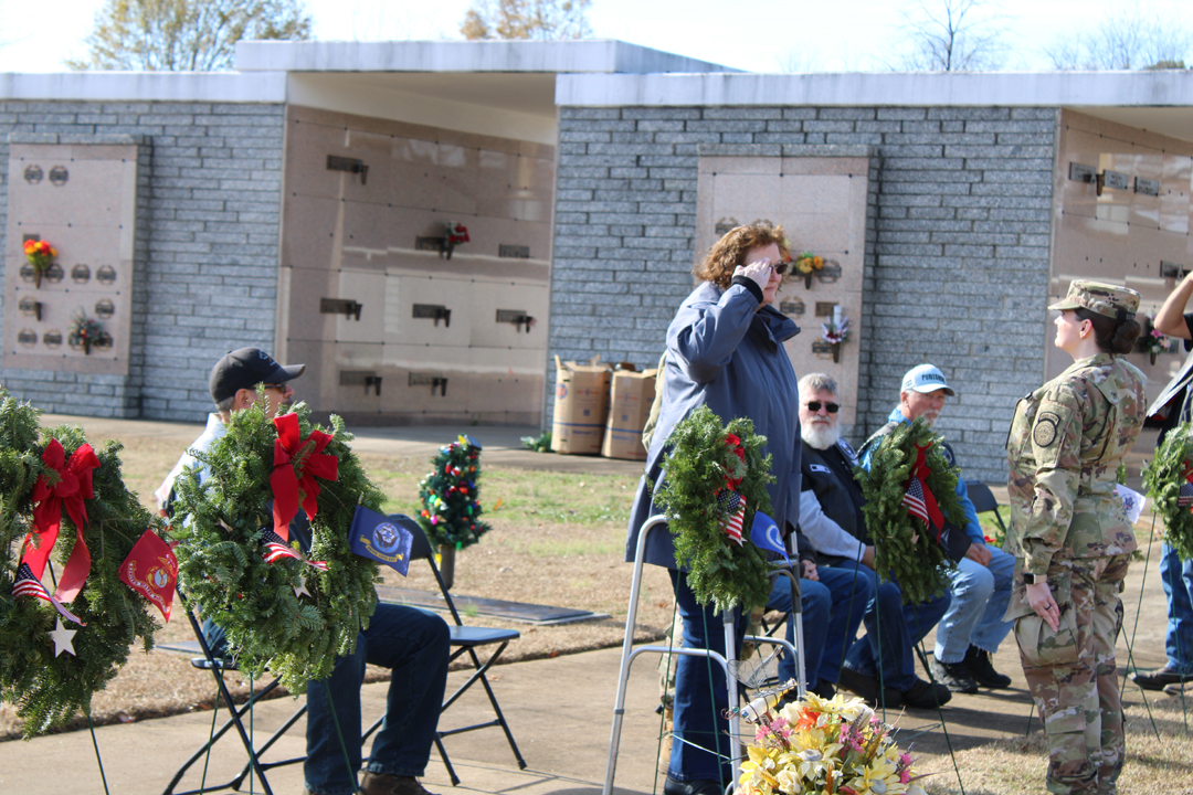 Sherry Harris, US Army, past Commander of American Legion Post 67 and past Pickens County Veterans Affairs Officer, salutes after placing a wreath for those serving in the US Space Force (Photo by Karen Brewer, The Pickens County Chronicle)