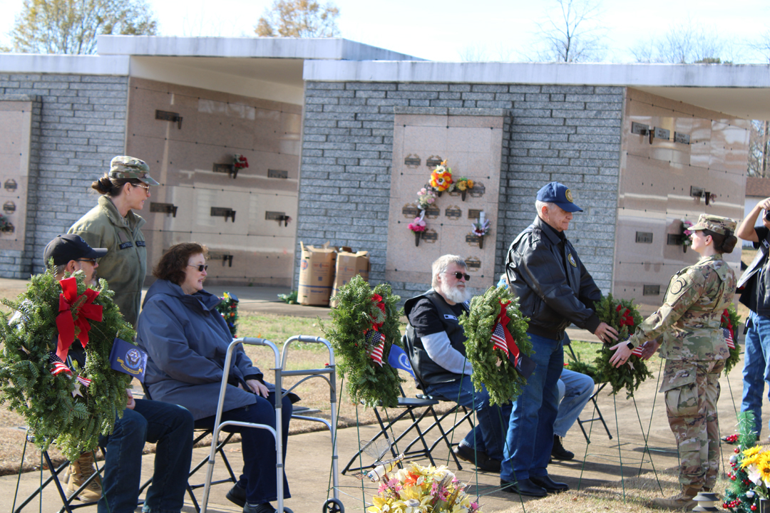 Frank Cantrell, US Army, past Commander of American Legion Post 67, places a wreath in memory of those who served in the US Coast Guard (Photo by Karen Brewer, The Pickens County Chronicle)