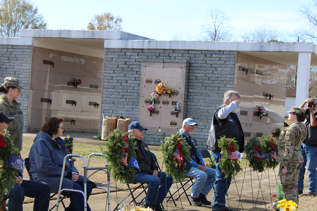 David McAllister, US Army, salutes after placing a wreath in memory of those who served in the US Merchant Marine (Photo by Karen Brewer, The Pickens County Chronicle)