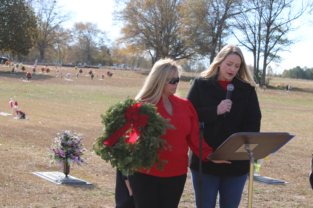 Melanie Gillespie describes the veteran's wreath. (Photo by Karen Brewer, The Pickens County Chronicle)