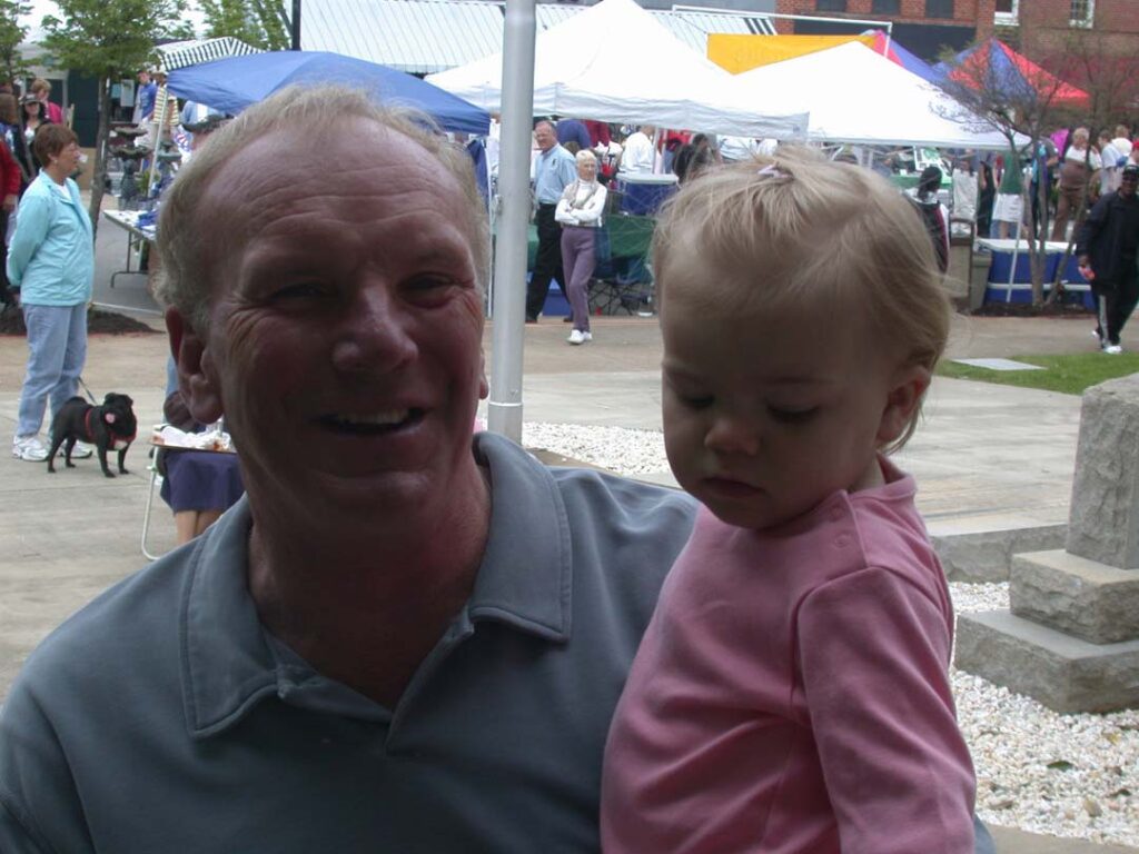 Sam with a granddaughter, Ryan, at the 2003 Pickens Azalea Festival (Photo by Karen Brewer)