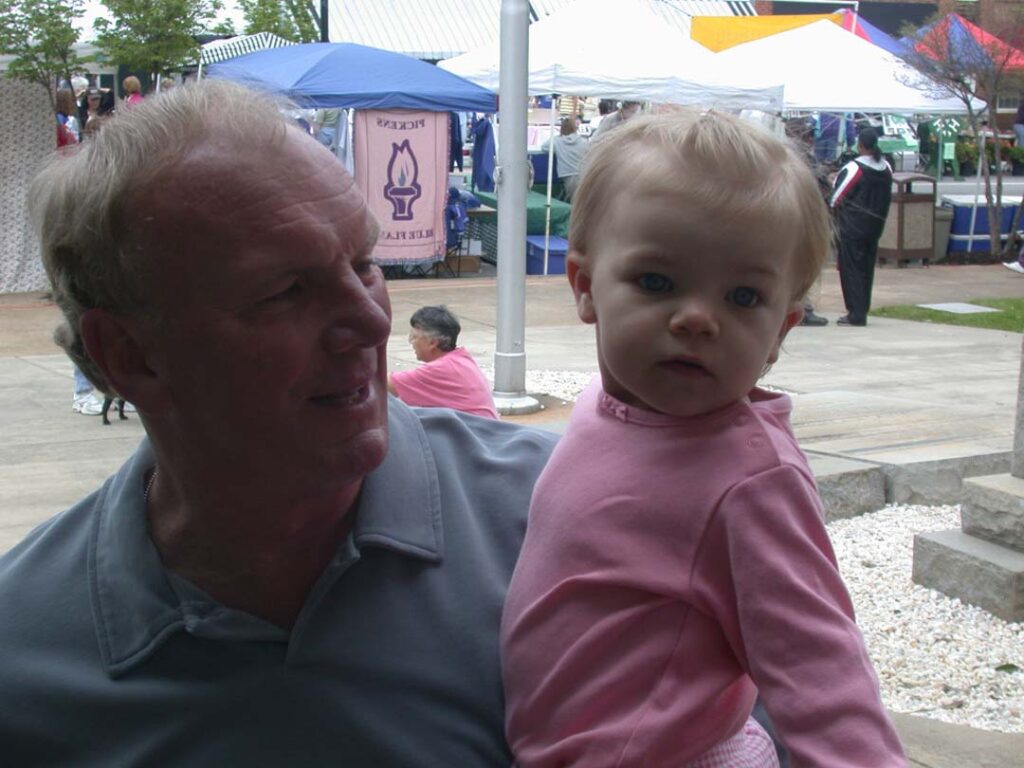 Sam with a granddaughter, Ryan, at the 2003 Pickens Azalea Festival (Photo by Karen Brewer)