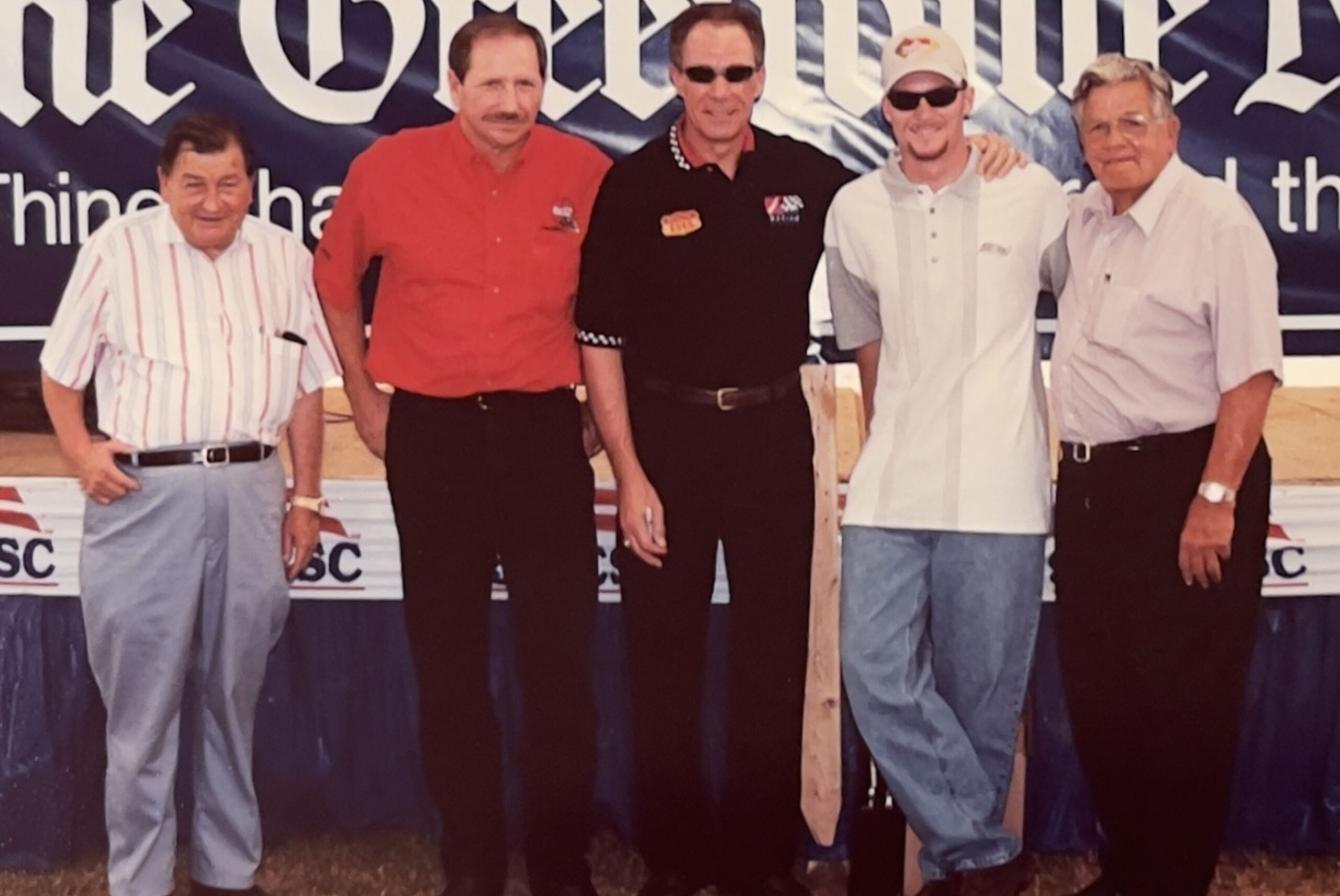 Tom Blackwell, Dale Earnhardt, Sr., Darrell Waltrip, Dale Earnhardt, Jr., Tom Blackwell circa late 1990's during an autograph session at the fair