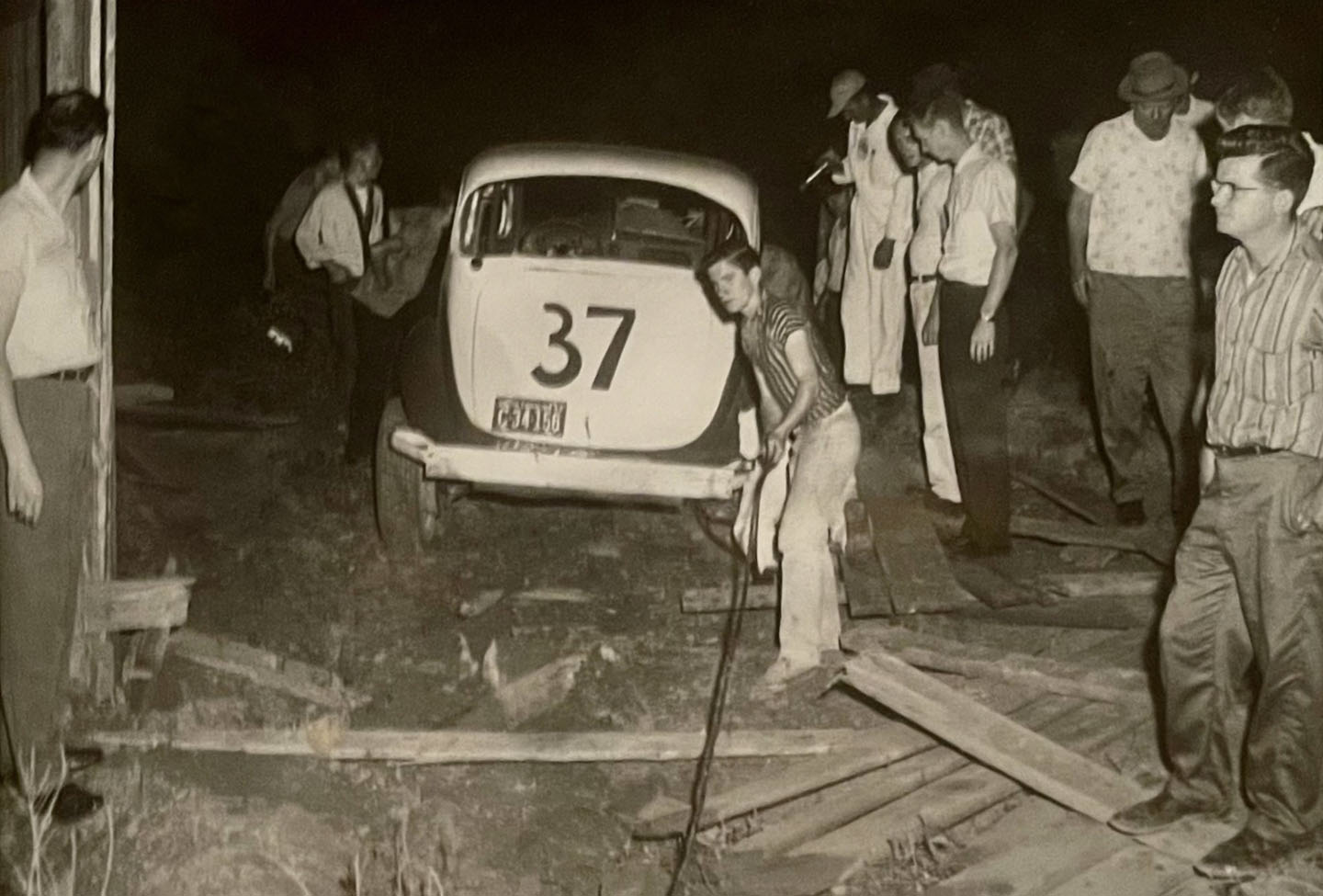 Cleaning up a wreck in the 1950's. Tom Blackwell is seen on the right.