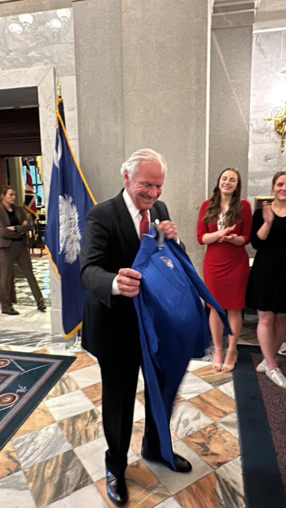 Giving Governor Henry McMaster a Blue Flame t-shirt (Pickens Blue Flame Volleyball photo)