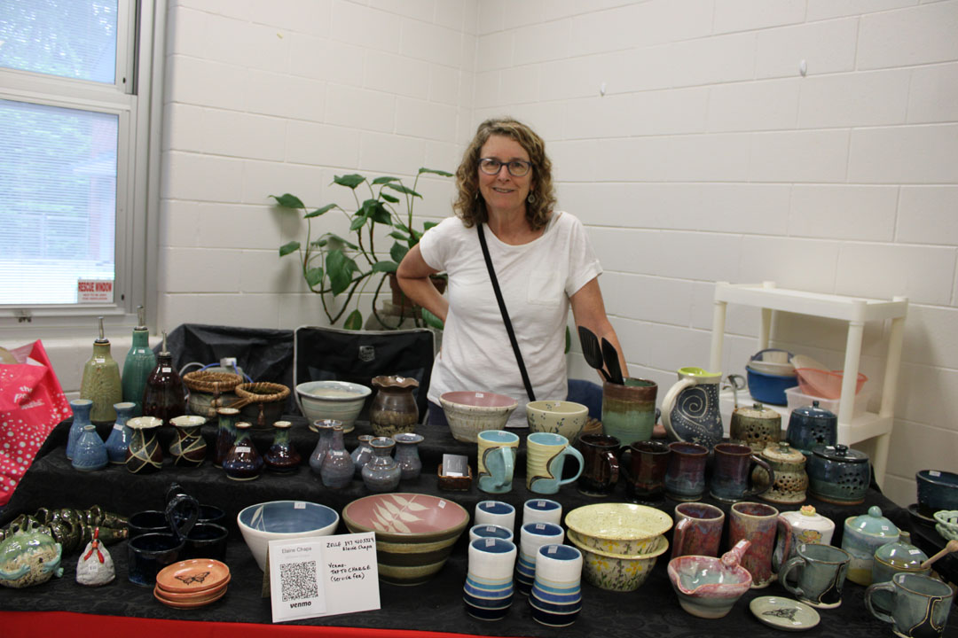 Elaine Chapa with her pottery (Photo by Karen Brewer, The Pickens County Chronicle)