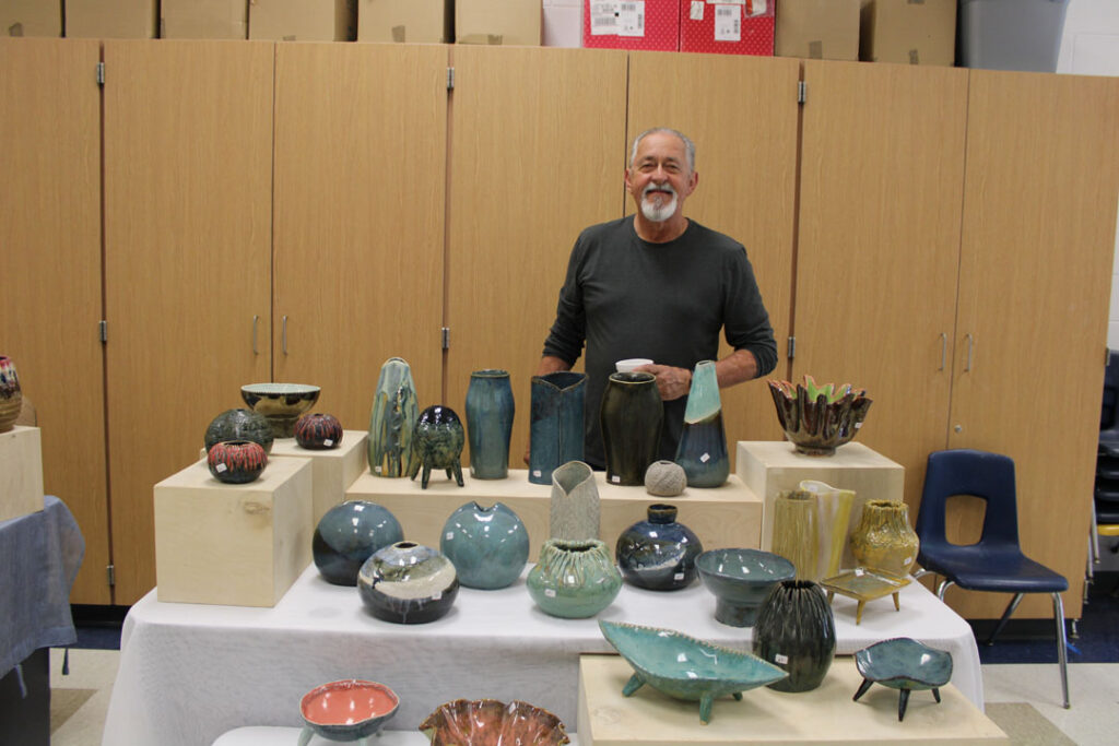 Ed Gardin with his pottery (Photo by Karen Brewer, The Pickens County Chronicle)