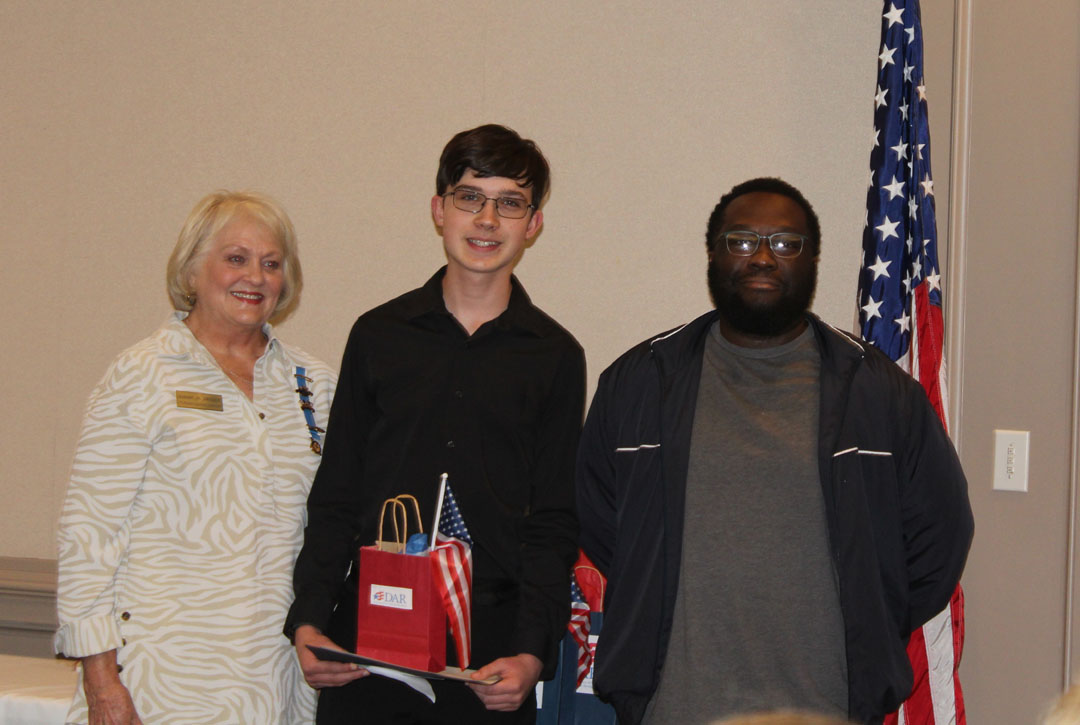 Dianne Crooks with student Luke Stone and his teacher, Tyreik James (Photo by Karen Brewer, The Pickens County Chronicle)