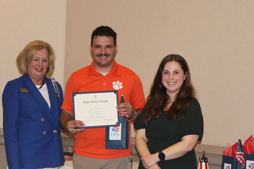 Fort Prince George Chapter member Julie Thompson with student Luke Hatfield and his guidance counselor, Quinn Buss (Photo by Karen Brewer, The Pickens County Chronicle)