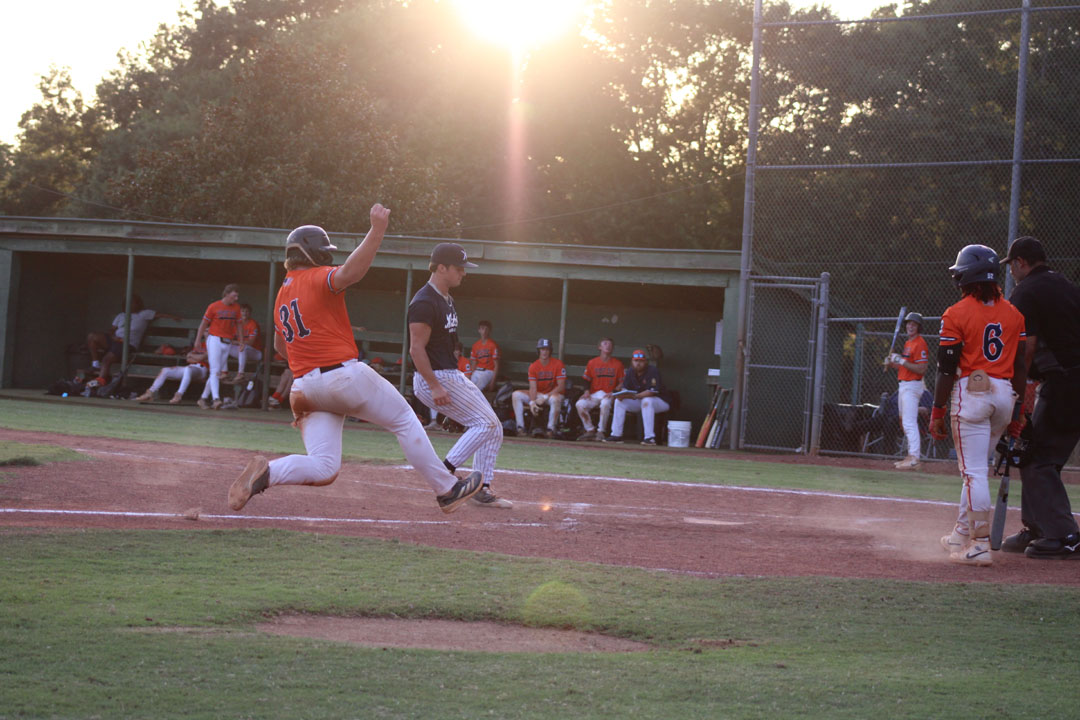 Zach Jochimsen slides home