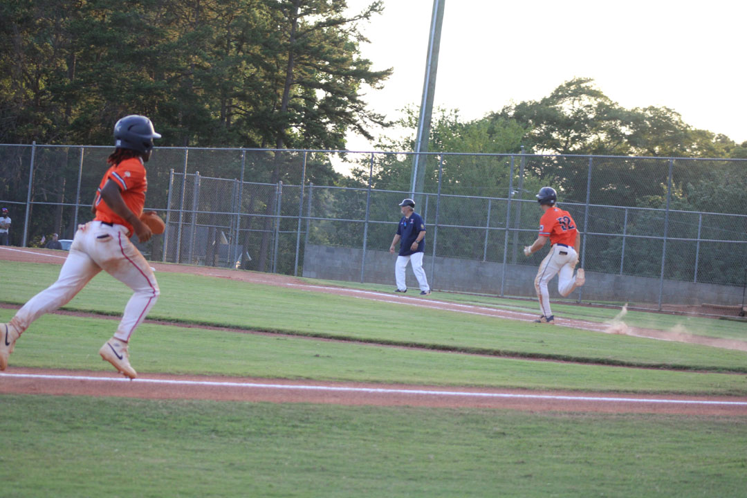 #6 Jasen Perry comes home as #52 Braden Mauro runs to first base