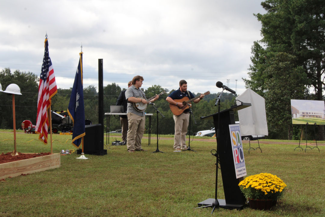 Jeremy McCollum, Pickens County Career and Technology Center instructor, and Ayden Chappell, Pickens High School, play the national anthem (Photo by Karen Brewer, The Pickens County Chronicle)