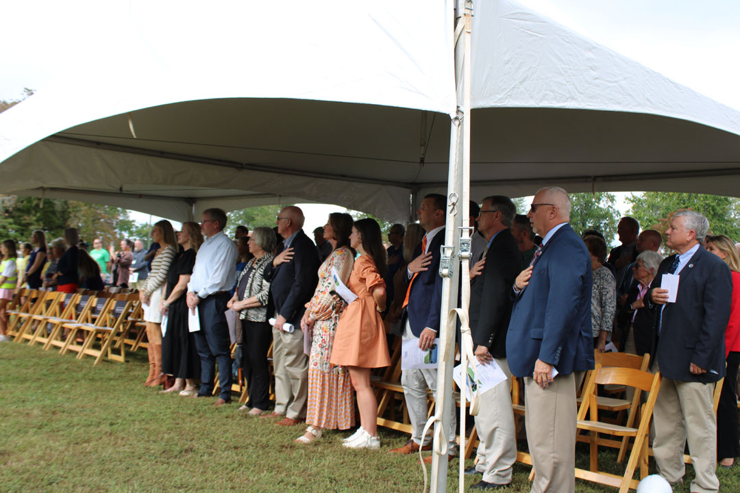 Everyone stands with their hands over their hearts during the national anthem. (Photo by Karen Brewer, The Pickens County Chronicle)