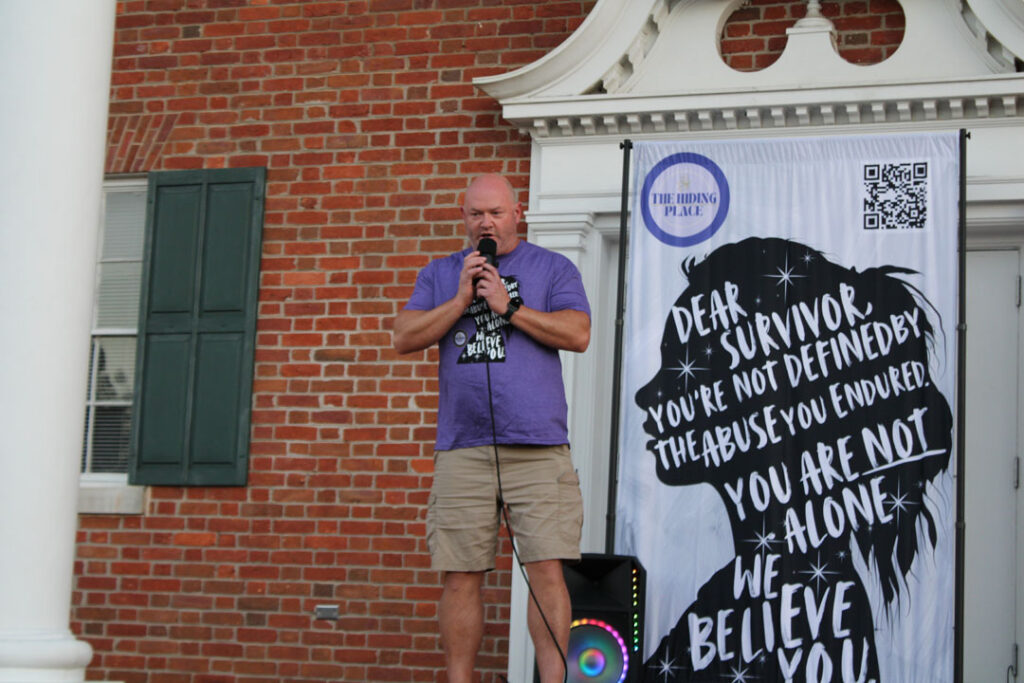 The Hiding Place's Board Treasurer Shawn Martin prays.