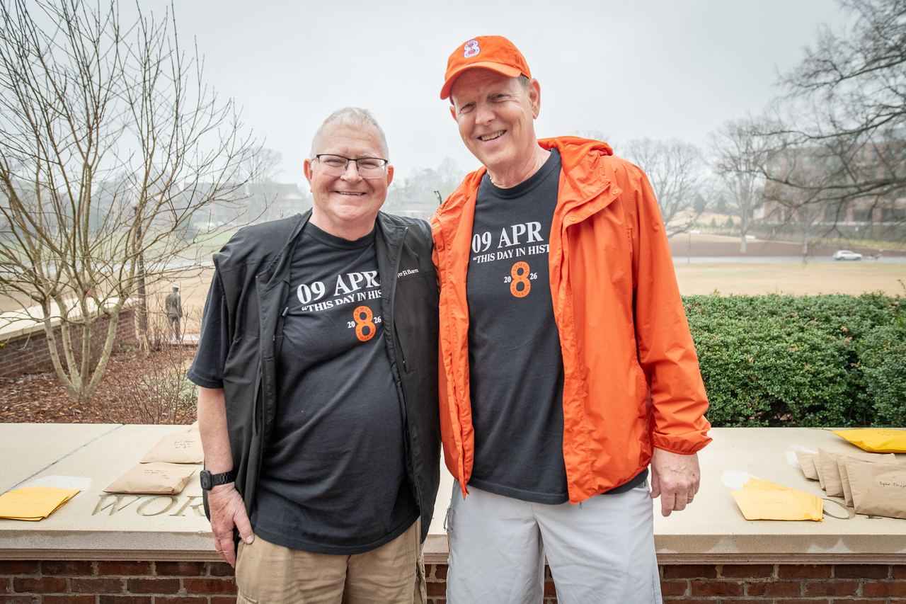 Hundreds of people participate in the 2026 Clemson 8 Challenge, an eight-mile run/walk/ruck march, on a misty Saturday morning, March 7, 2026. The Challenge was created to honor the 25 known Clemson alumni who suffered as POWs in all wars. It was originally created for 1938 Clemson alumnus, professor emeritus and WWII hero Ben Skardon, a survivor of the Bataan Death March, but has expanded to include Clemson POWs from all wars. Money raised from the event goes toward sending teams of Clemson ROTC students to participate in the Bataan Memorial Death March at White Sands Missile Range, NM. Sophomore finance major GB Stalnaker served as master of ceremonies. (Photo by Ken Scar)