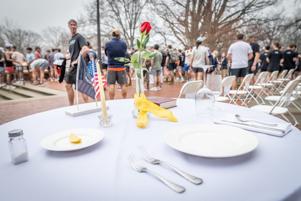 Hundreds of people participate in the 2026 Clemson 8 Challenge, an eight-mile run/walk/ruck march, on a misty Saturday morning, March 7, 2026. The Challenge was created to honor the 25 known Clemson alumni who suffered as POWs in all wars. It was originally created for 1938 Clemson alumnus, professor emeritus and WWII hero Ben Skardon, a survivor of the Bataan Death March, but has expanded to include Clemson POWs from all wars. Money raised from the event goes toward sending teams of Clemson ROTC students to participate in the Bataan Memorial Death March at White Sands Missile Range, NM. Sophomore finance major GB Stalnaker served as master of ceremonies. (Photo by Ken Scar)