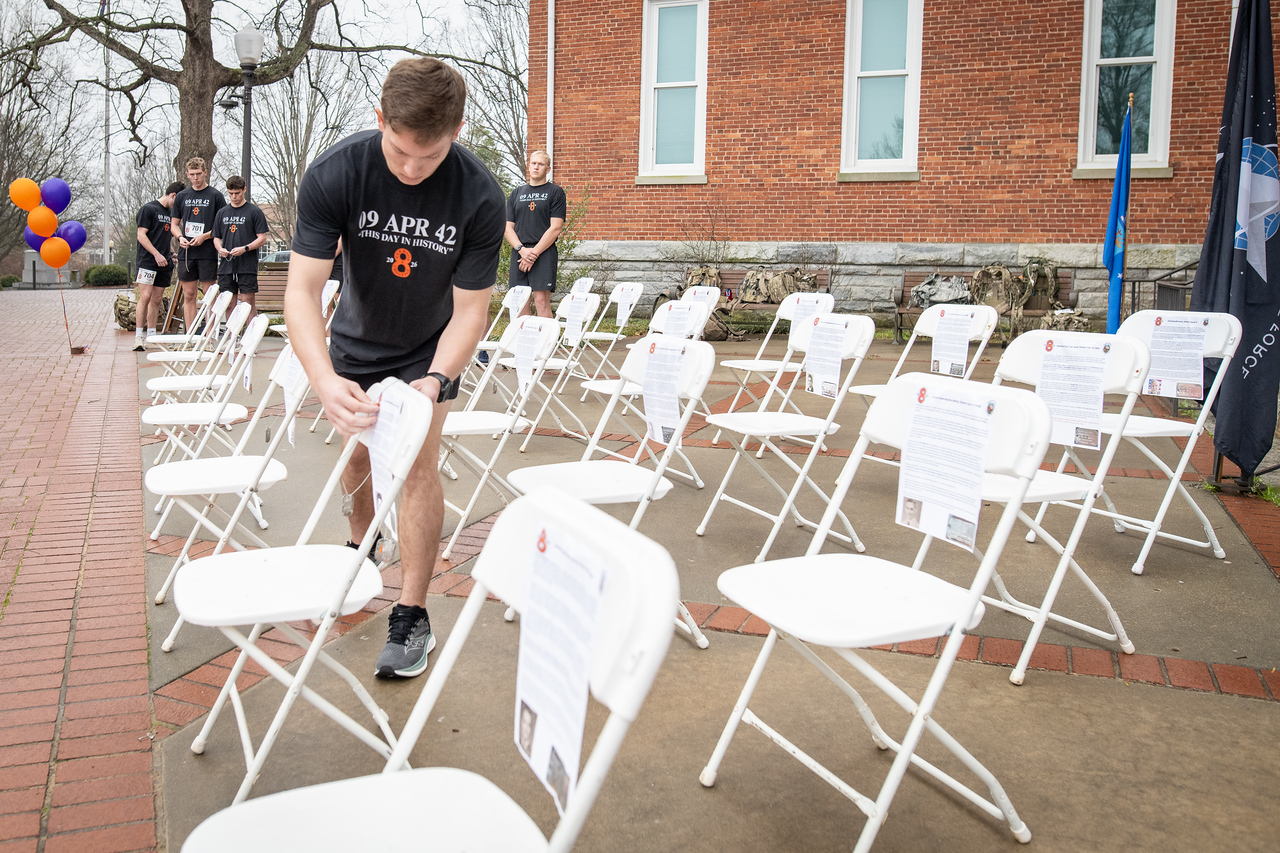 Hundreds of people participate in the 2026 Clemson 8 Challenge, an eight-mile run/walk/ruck march, on a misty Saturday morning, March 7, 2026. The Challenge was created to honor the 25 known Clemson alumni who suffered as POWs in all wars. It was originally created for 1938 Clemson alumnus, professor emeritus and WWII hero Ben Skardon, a survivor of the Bataan Death March, but has expanded to include Clemson POWs from all wars. Money raised from the event goes toward sending teams of Clemson ROTC students to participate in the Bataan Memorial Death March at White Sands Missile Range, NM. Sophomore finance major GB Stalnaker served as master of ceremonies. (Photo by Ken Scar)