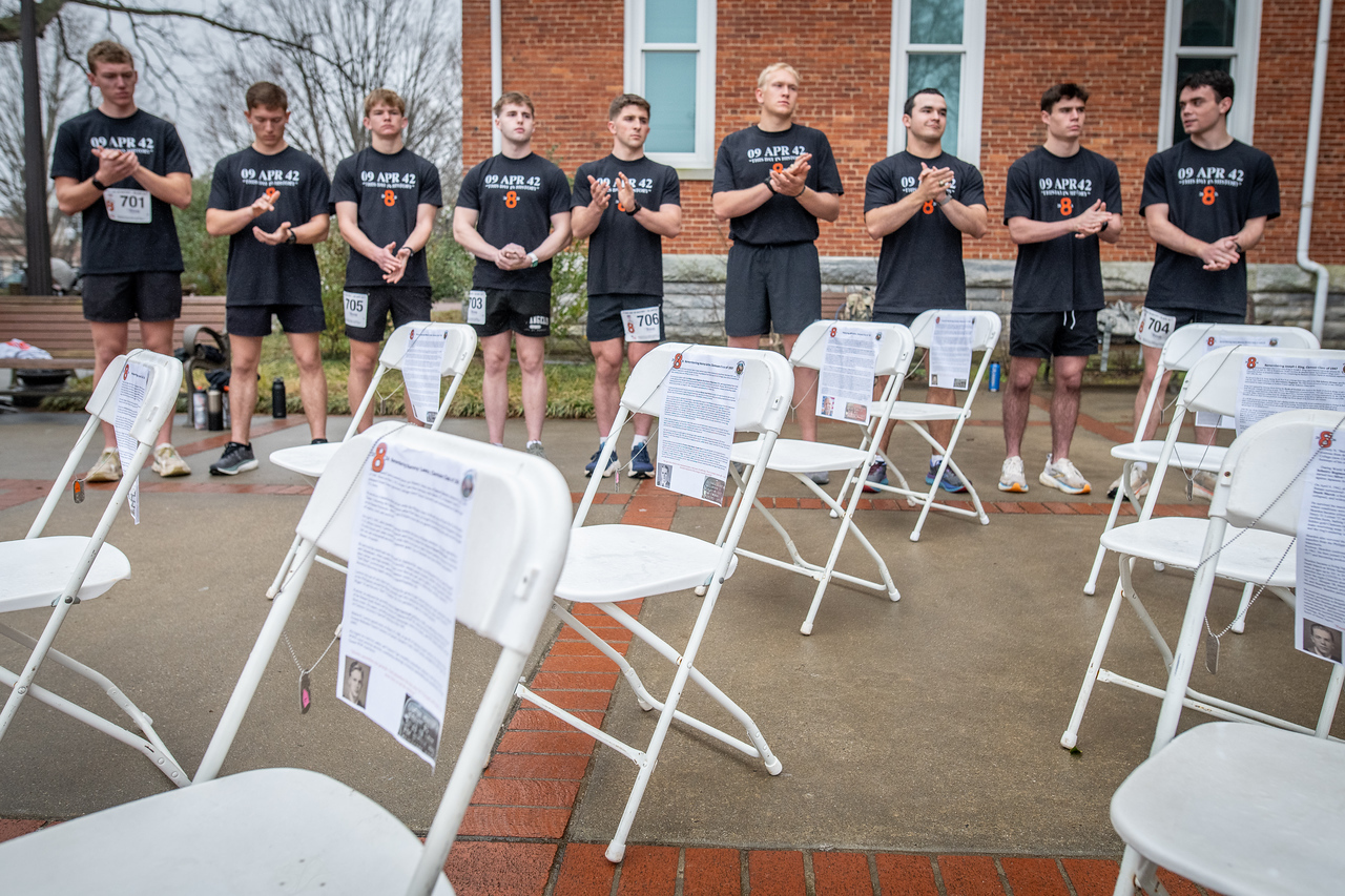 Hundreds of people participate in the 2026 Clemson 8 Challenge, an eight-mile run/walk/ruck march, on a misty Saturday morning, March 7, 2026. The Challenge was created to honor the 25 known Clemson alumni who suffered as POWs in all wars. It was originally created for 1938 Clemson alumnus, professor emeritus and WWII hero Ben Skardon, a survivor of the Bataan Death March, but has expanded to include Clemson POWs from all wars. Money raised from the event goes toward sending teams of Clemson ROTC students to participate in the Bataan Memorial Death March at White Sands Missile Range, NM. Sophomore finance major GB Stalnaker served as master of ceremonies. (Photo by Ken Scar)
