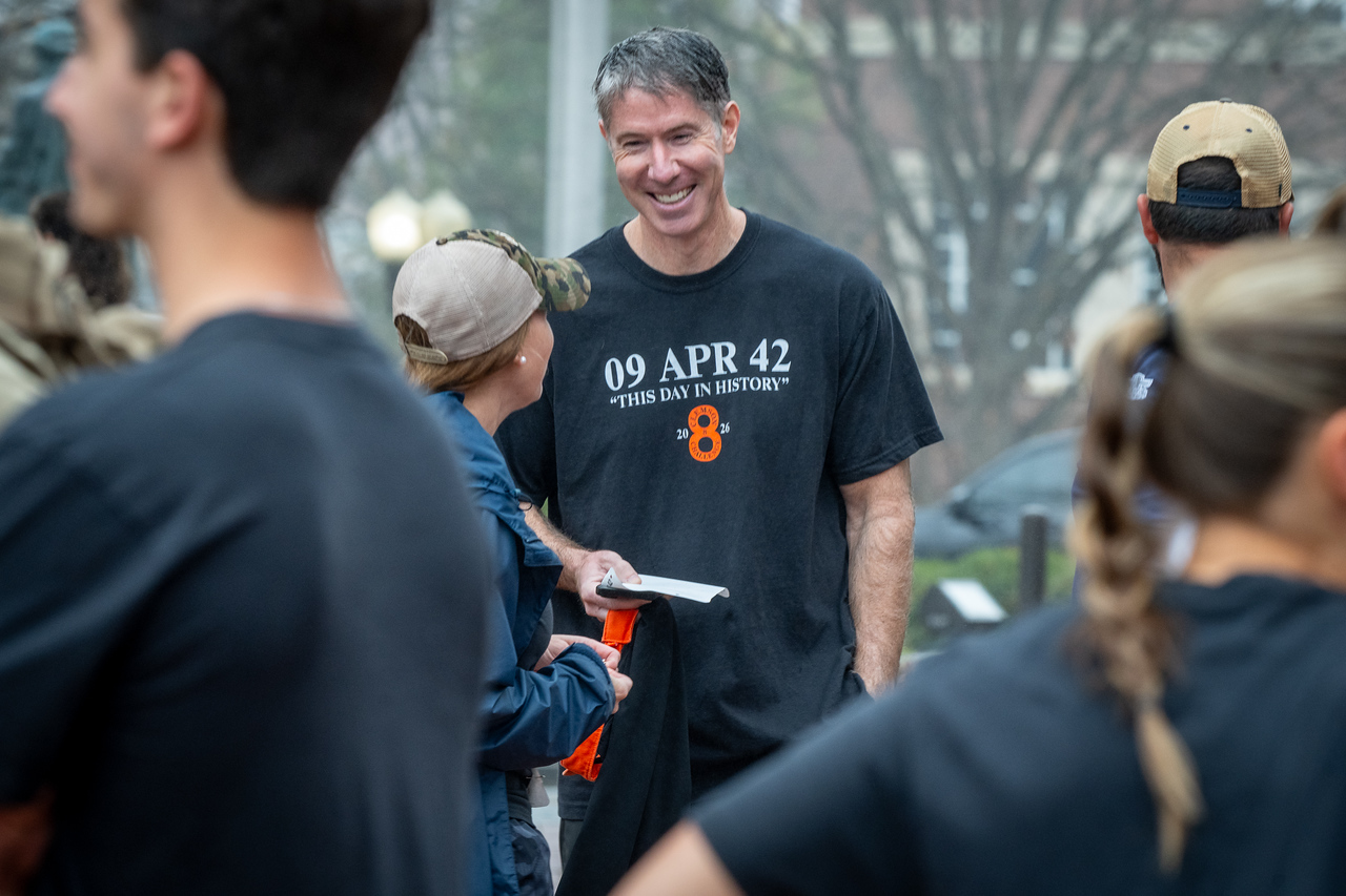 Hundreds of people participate in the 2026 Clemson 8 Challenge, an eight-mile run/walk/ruck march, on a misty Saturday morning, March 7, 2026. The Challenge was created to honor the 25 known Clemson alumni who suffered as POWs in all wars. It was originally created for 1938 Clemson alumnus, professor emeritus and WWII hero Ben Skardon, a survivor of the Bataan Death March, but has expanded to include Clemson POWs from all wars. Money raised from the event goes toward sending teams of Clemson ROTC students to participate in the Bataan Memorial Death March at White Sands Missile Range, NM. Sophomore finance major GB Stalnaker served as master of ceremonies. (Photo by Ken Scar)