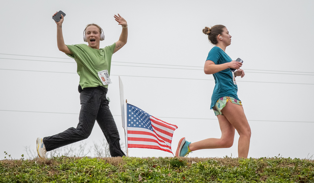Hundreds of people participate in the 2026 Clemson 8 Challenge, an eight-mile run/walk/ruck march, on a misty Saturday morning, March 7, 2026. The Challenge was created to honor the 25 known Clemson alumni who suffered as POWs in all wars. It was originally created for 1938 Clemson alumnus, professor emeritus and WWII hero Ben Skardon, a survivor of the Bataan Death March, but has expanded to include Clemson POWs from all wars. Money raised from the event goes toward sending teams of Clemson ROTC students to participate in the Bataan Memorial Death March at White Sands Missile Range, NM. Sophomore finance major GB Stalnaker served as master of ceremonies. (Photo by Ken Scar)