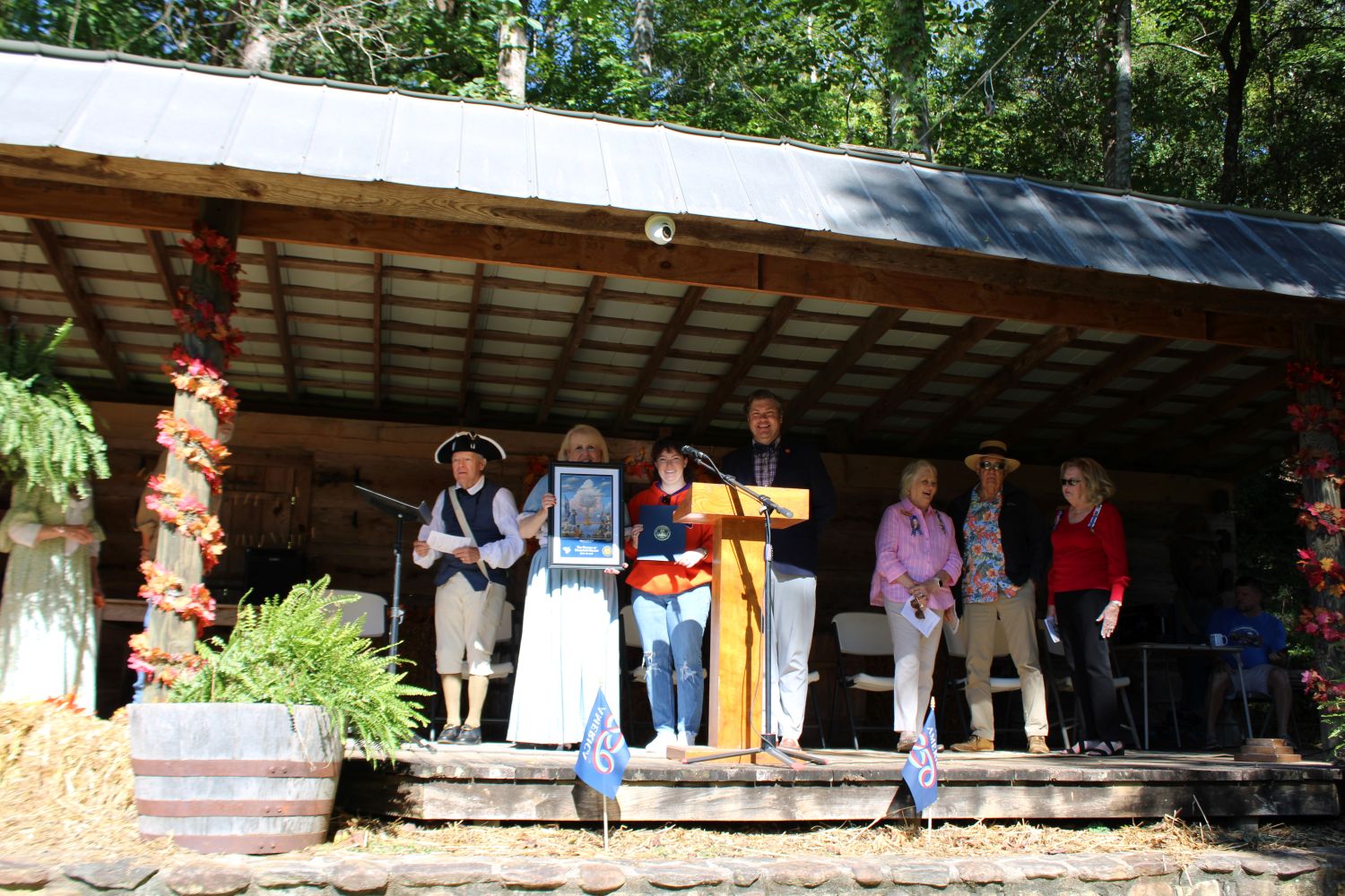 Hannah Thompson from Clemson University Historic Properties presents a print from the South Carolina 250 Commission and a Proclamation from the Governor. (Photo by Karen Brewer, The Pickens County Chronicle)