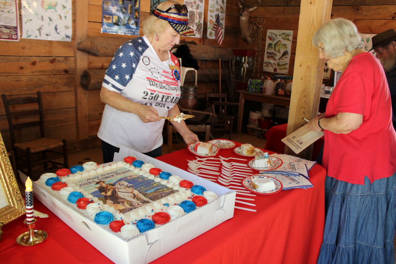 Pickens County America 250 Committee member Joan Groome cuts the birthday cake. (Photo by Karen Brewer, The Pickens County Chronicle)