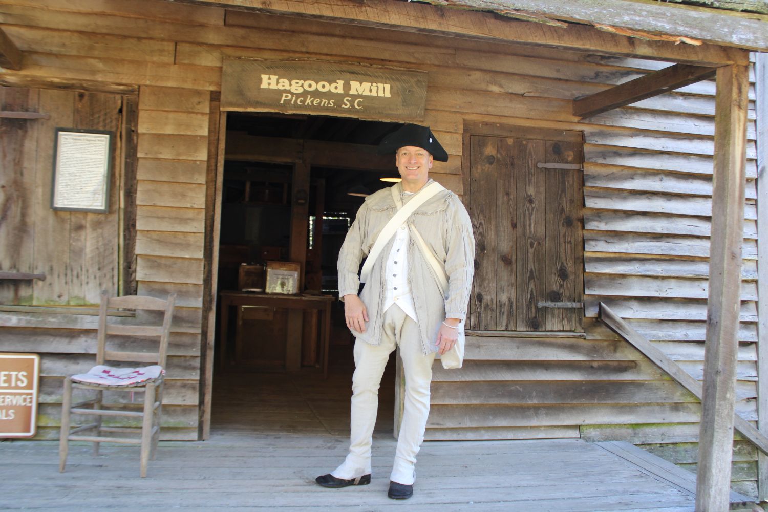 Militia reenactor David Cooper is pictured in front of the historic Hagood Mill. (Photo by Karen Brewer, The Pickens County Chronicle)